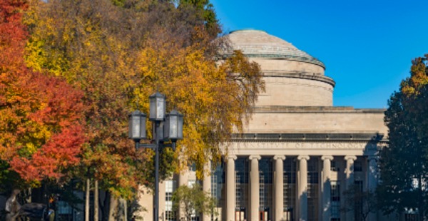 MIT Dome with a tree changing colors for fall.