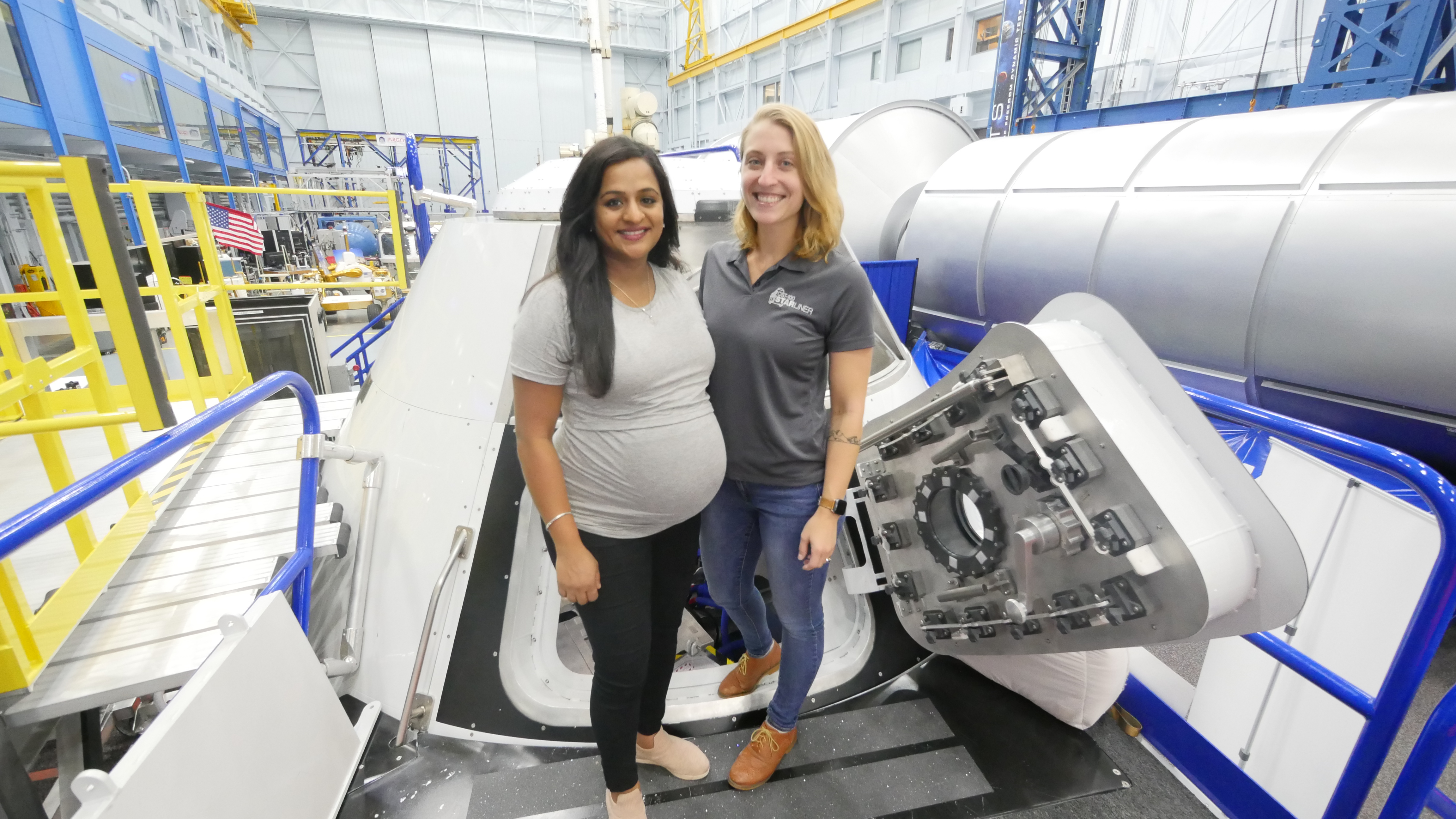 Kavya Manyapu SM ’10 and Celena Dopart SM ’14 with the Boeing Starliner