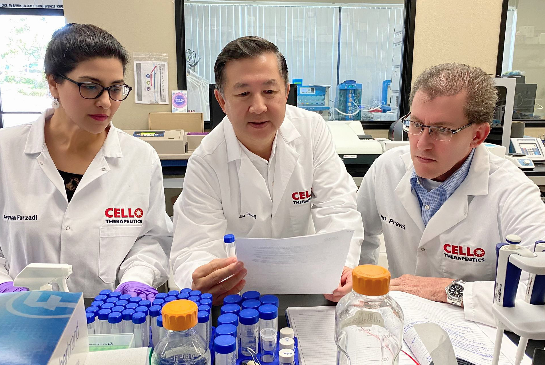 Jie Zhang in a lab with two other people 