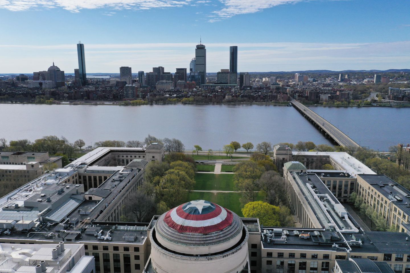 View of the Boston skyline with Captain America's shield on the MIT Great Dome