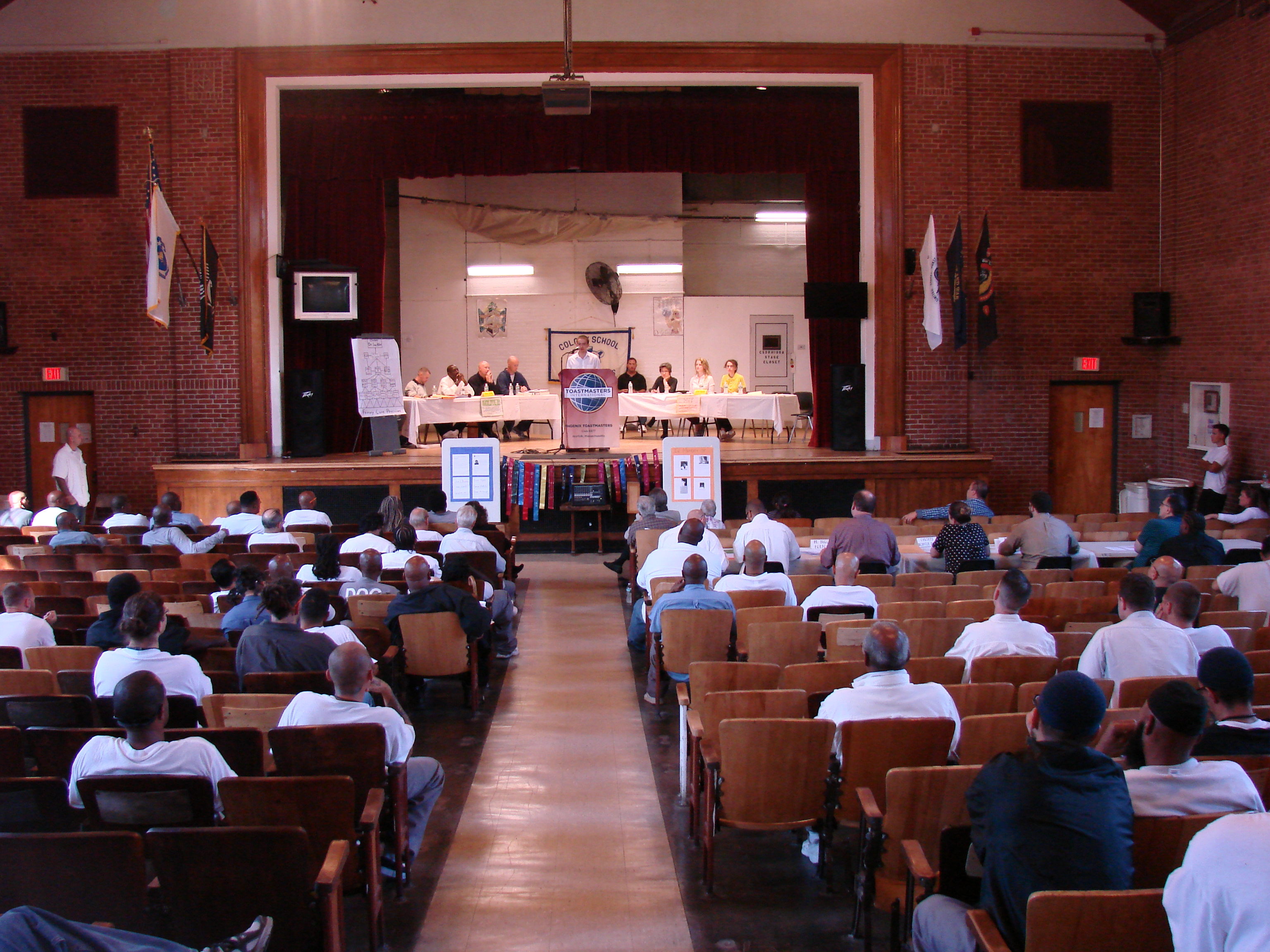 The MIT Debate team facing the debate team at MCI Norfolk.