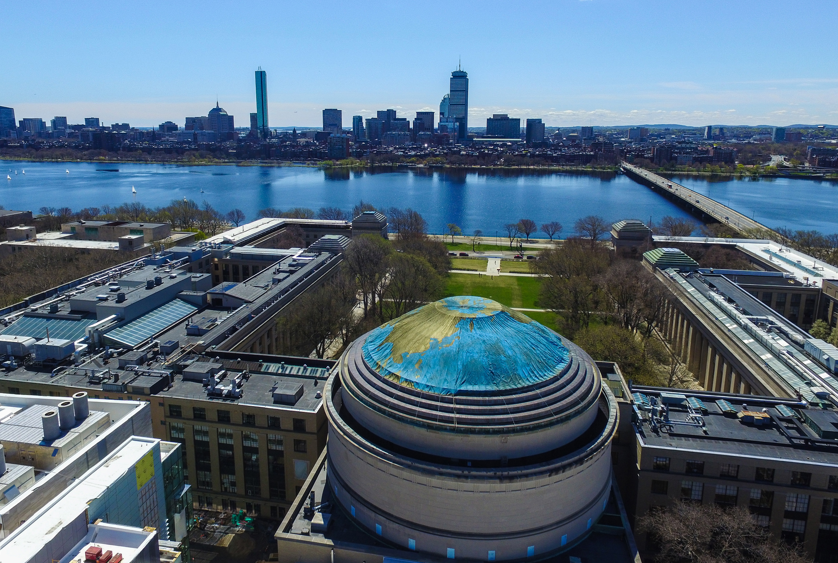 Aerial view of MIT dome decorated with image of Earth