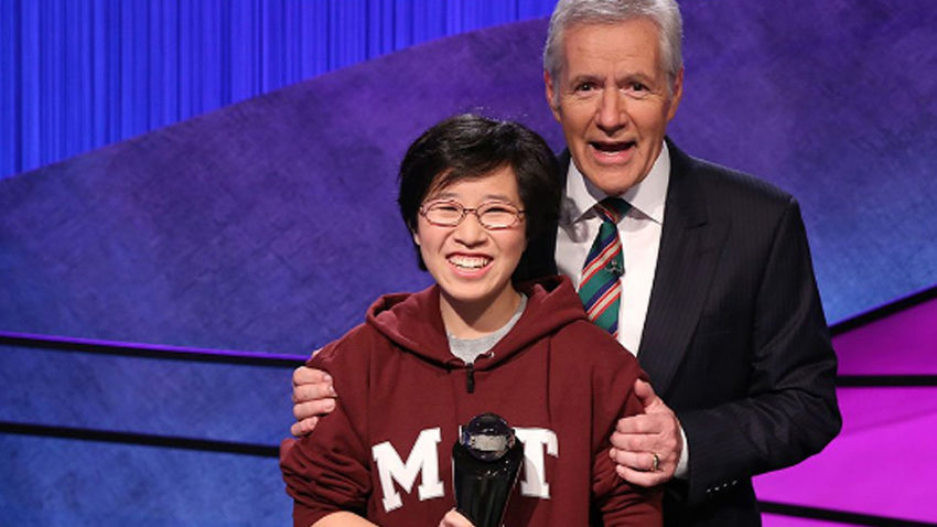 Jeopardy! host Alex Trebek congratulates Lilly Chin ’17 on her College Championship victory in February.