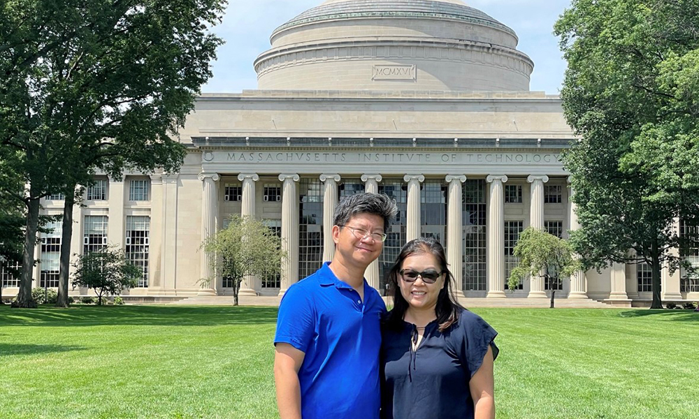 Alex and Jenny Chen standing on Killian Court with the Great Dome behind them