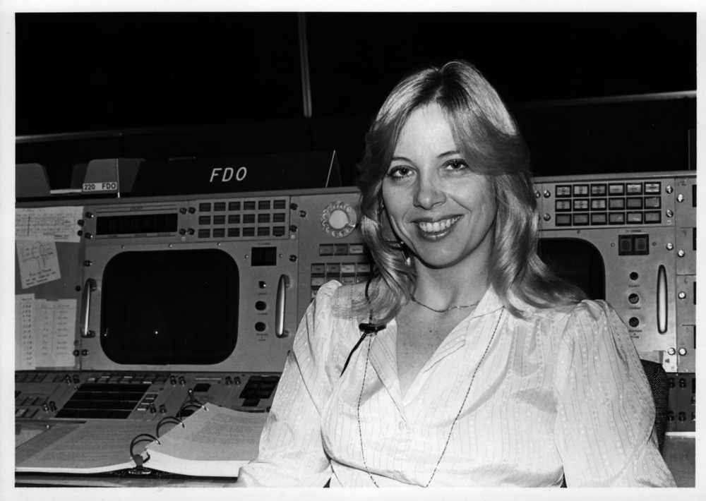 Black and white photo of Linda Dawson at Mission Control at the Johnson Space Center at NASA Houston.