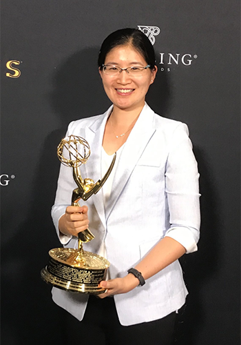 Vivienne Sze holds an engineering Emmy Award