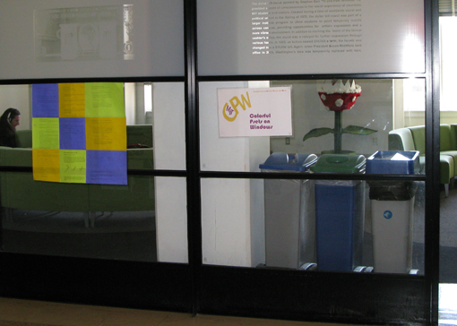 The sign for this hack outside the student lounge off of Lobby 10 reads Colorful Psets on Windows. In the background is the Carnivorous Plants Win Hack.