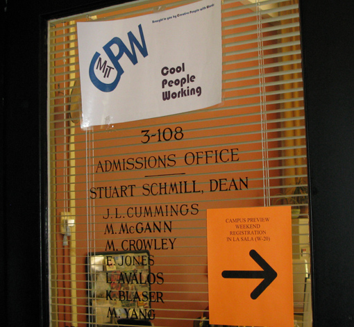 This sign, Cool People Working, appeared outside the Admissions Office.