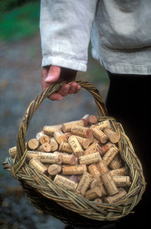 A French winemaker with a basket of corks, Banyuls. (© Owen Franken)