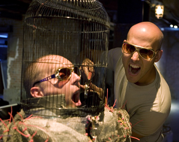 Media Lab PhD candidate and Time Warp Cohost Jeff Lieberman '00, SM '04, SM '06 (right) with Dr. Megavolt, a performance artist who uses high voltage—millions of volts—as his medium. His birdcage hat protects him from deadly shocks during his shows. Photo courtesy of the Discovery Channel.