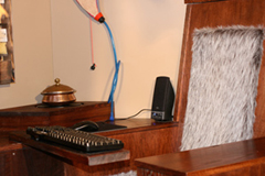 The Wow Pod's throne, keyboard, hotplate, surround sound, and water.