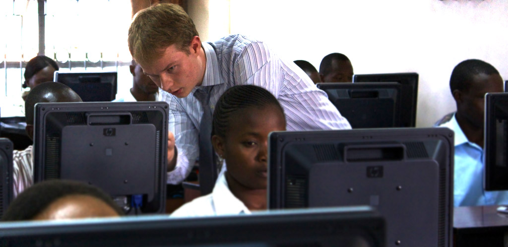 AITI teacher and MIT undergrad, Cory Smith, assists students at Strathmore University in Kenya