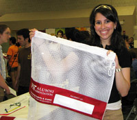 Every year the Alumni Association hands out laundry bags to new students at the Activities Midway.