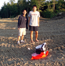 Justin Lee and Oliver Yeh retrieve the downed camera, located using the attached GPS device.