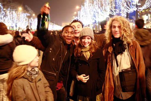 New Year's Eve 2007 on the Champs Elysee. Franken's son, Tunui (far right), his girlfriend, Cecile (to his left), and his daughter (far left), Manui (© Owen Franken).