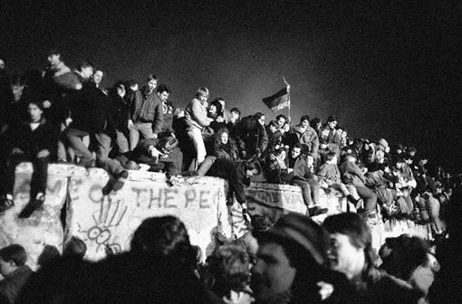 Reunited Germans atop the Berlin Wall