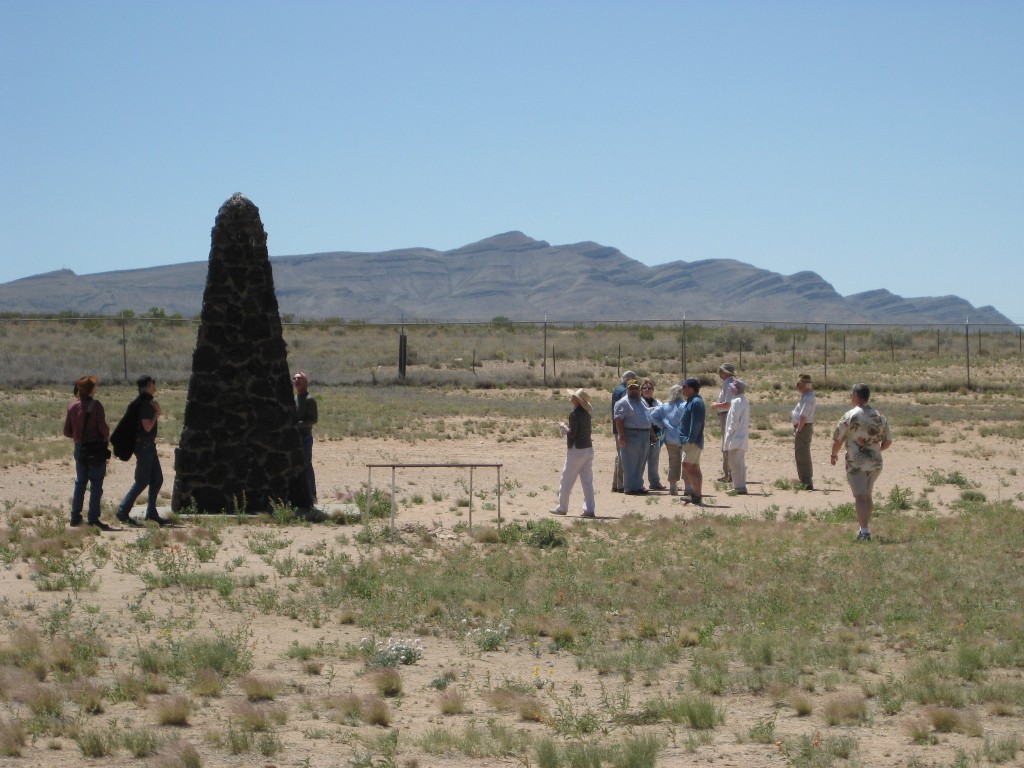 MIT travelers visit the site of the Trinity test, the world's first nuclear weapons explosion; the lava obelisk marks ground zero. Photos: Nancy DuVergne Smith