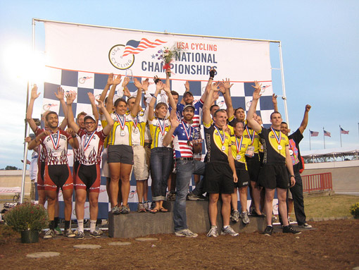 The MIT athletes celebrate their victory. Also on the awards podium (or next to it) are teams from DePauw and Army.