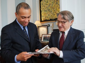 Gruenbaum shows the Holocaust Museum calendar to Massachusetts governor Deval Patrick.