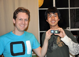 Mark Zhang '13 (right) shows off part of Sifteo's alternative gaming system.