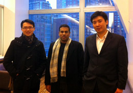 Qi Qin (far right) with Goldman Sachs trader ChungKit Chan '04 (far left) and trader/managing director Rajesh Venkataramani PhD '00, MBA '00.