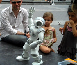 The first-ever live guerrilla robot performance was in Washington Square Park in Manhattan on Friday August 9, 2010. On "stage" was the Nao robot of Aldebaran Robotics, which is 23 inches tall, humanoid, and widely used as a robotic platform in academic research today.