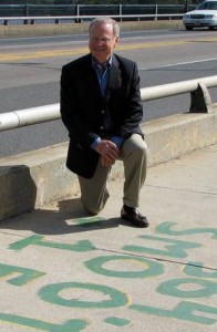 Olli Smoot '62 on the repainted Mass. Ave. bridge.