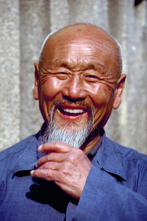 Portrait of a laughing Chinese man, April 1985, China (© Owen Franken/CORBIS ).