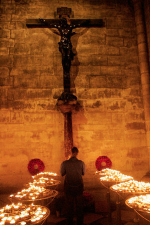 A person at a midnight service at Notre Dame Cathedral in Paris