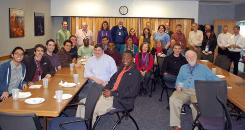 IAP Externs Timothy Joubert '13, Lisa Johnson, Paul Lazarescu '13, Brandon Le '15, Toks Fifo '14, Nnaemeka Opara '12, Ryan Lacey '14, and Gholson Glass '14 (not pictured) are joined by several decades of MIT Alumni at NASA's Goddard Space Flight Center in Greenbelt Maryland on January 25, 2012, at a pizza lunch and Toast to IAP celebration.