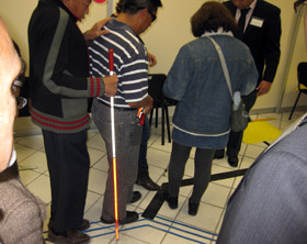 Blind users testing out a prototype for a bus-stop improvement