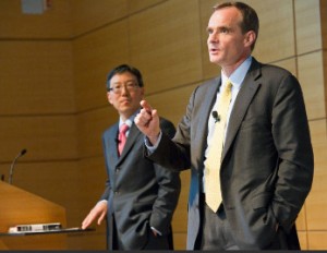 Johnson, right, and Kwak discuss how to manage America's national debt.