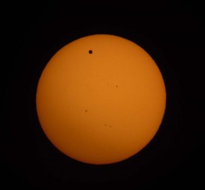 Venus transiting the Sun photographed at the Stage Neck Inn at 7:31pm, Tuesday, June 5 through the Dobsonian telescope. The small specks are sunspots. Photo: Lee Lancaster.