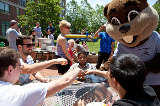 Tim the Beaver makes an appearance at SP's 10th Anniversary Brunch & Carnival, serving appetizers to hungry students. Photo: Dani De Steven for the Office of the Dean of Student Life.