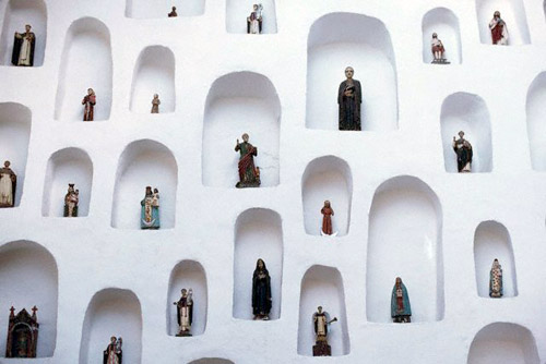 Religious figurines in wall niches, Quito, Ecuador (© Owen Franken/CORBIS).