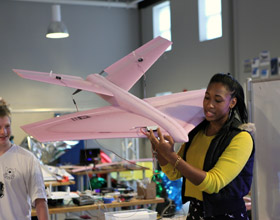 For the Fall 2012 theme of flight, students in one studio built heavier-than-air radio controlled airplanes. They learned about different methods of lift, propulsion, construction, and design. One team built a glider with long, thin wings. Another team built a futuristic-looking airplane with tapered wings and a round body. A third team made a plane that could change the angle of its propellers, allowing it to both hover like a helicopter, and glide like an aircraft. Read more about the airplane-design studio.