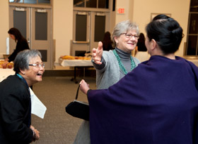 Debbie Samuels embraces Kyoko Wada at the 40th anniversary reception. Both are MIT spouses.