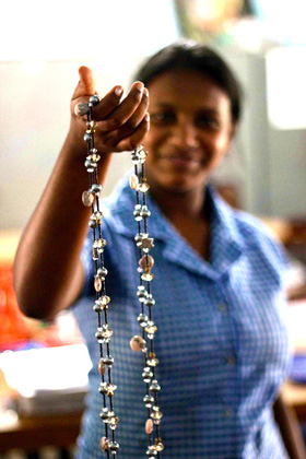 An Emerge participant showing off some of her jewelry creations.