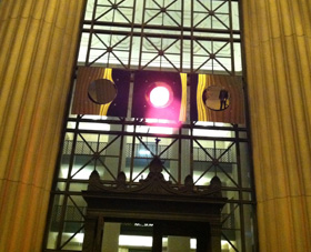 The Local Warming installation above the door leading to Lobby 7.