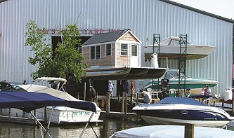 Tiny house, solar boat before launch. Photo: Roger Amsden.