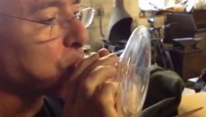 Peter Houk performs on a glass instrument.