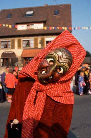 A festival celebrant wears a witch mask in Biberach, Germany. © Owen Franken