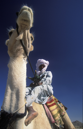 Taureg and his camel in Algeria (© Owen Franken).