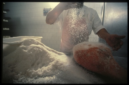 Salting Parma Ham, Langhirano, Italy (© Owen Franken).
