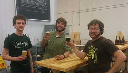 Daniel Rassi, Ben Holmes, and Ronn Friedlander celebrate their latest brews at Aeronaut Brewery. 