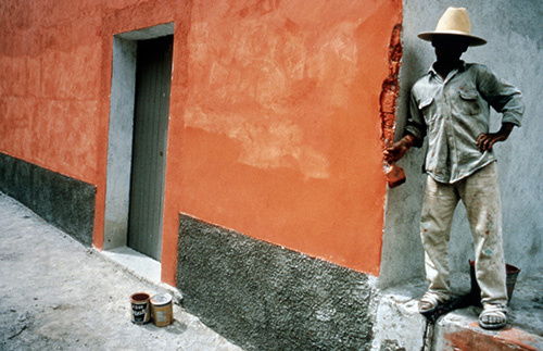 Teenager painting a wall, Oaxaca, Mexico (© Owen Franken)