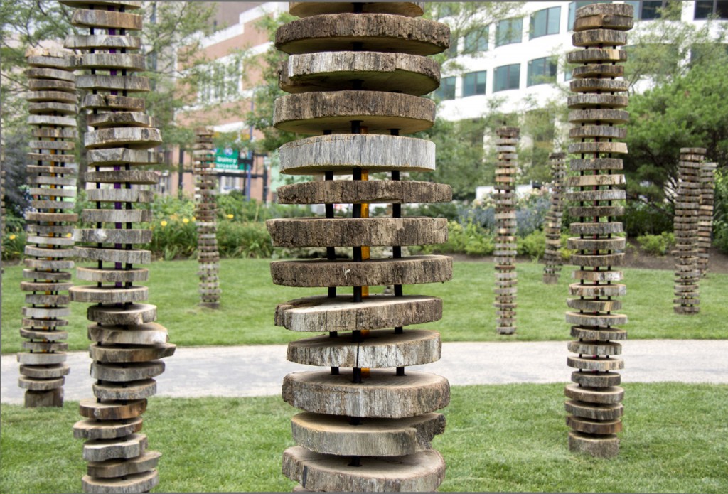Marginal is made from eight recycled oak pilings from a shipyard in Boston Harbor that have been sliced into more than one thousand cross sections and reassembled into eighteen new figures in a grid.
