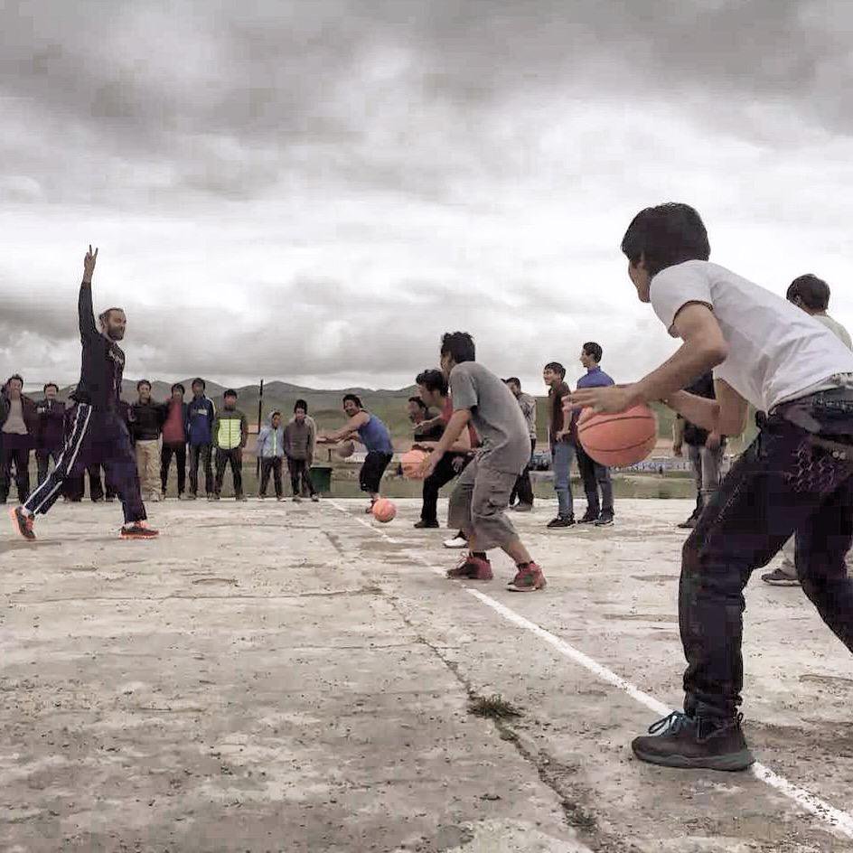 Johnson leads basketball practice in Tibet. 