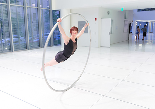 Circus artist Alexis Hedrick spins on her Cyr wheel at MIT's Media Lab, Cambridge, MA (© Clinton Blackburn).
