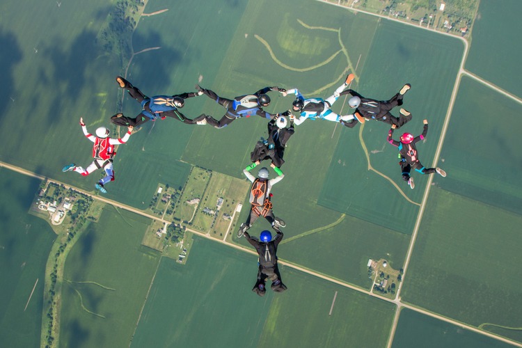 MIT alums skydiving in the shape of a T for Tech
